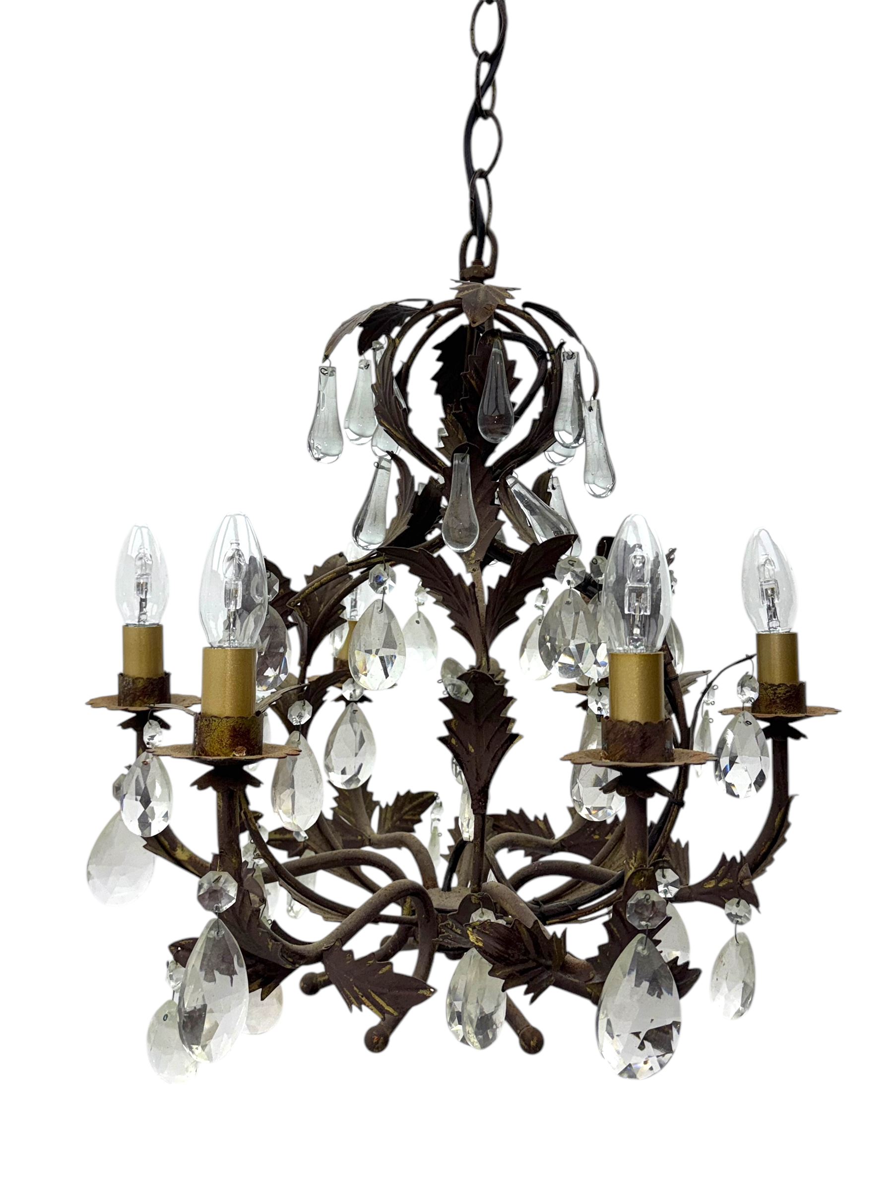 20th century distressed gilt tole chandelier, with six curved leaf clasped scrolling arms and frame, hung with lustre drops, approximately H50cm