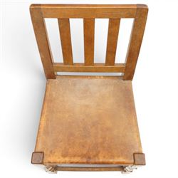 Mouseman - 1940s oak side chair, the slat-back over a slung leather seat, raised on octagonal front supports united by box stretcher, carved with slim mouse signature, by the workshop of Robert Thompson of Kilburn