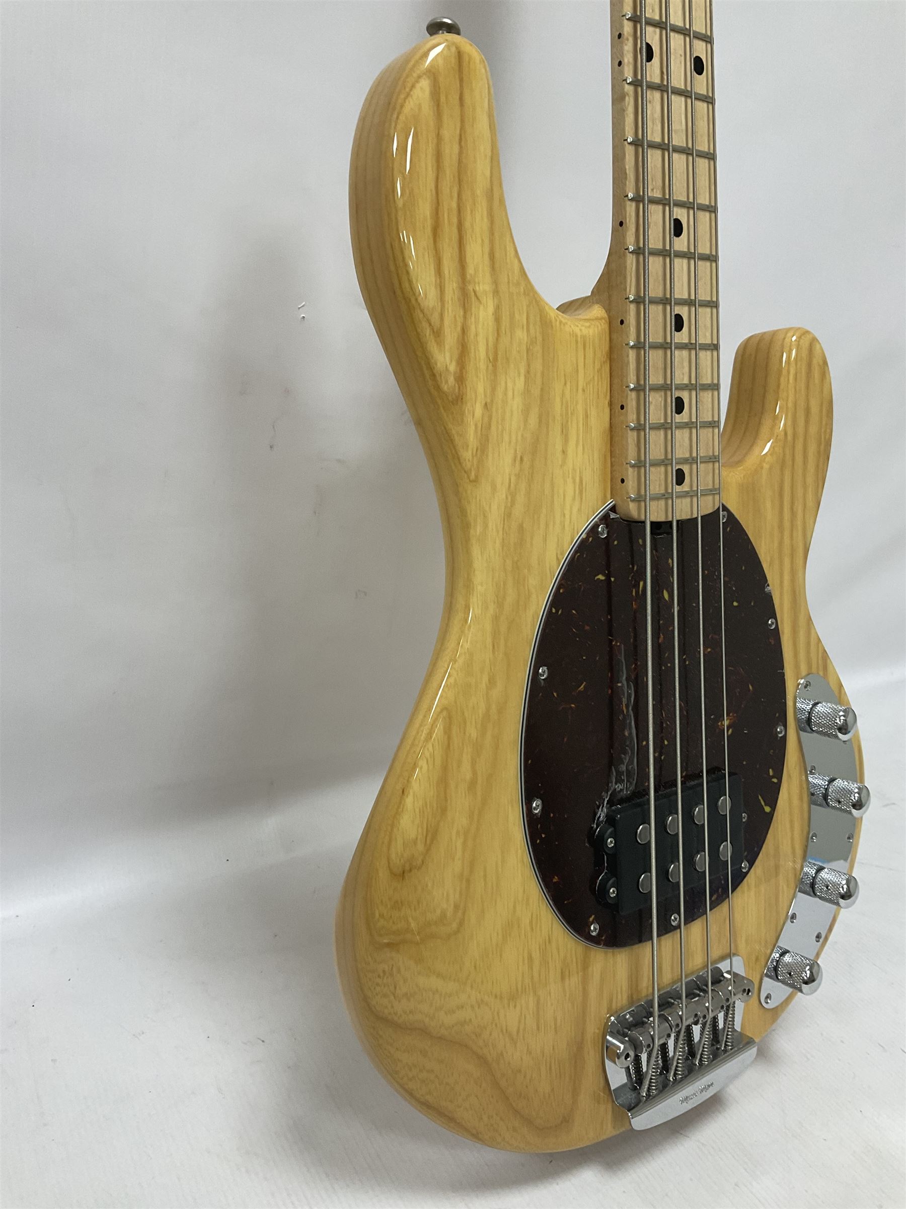 Ernie Ball Music Man Sting Ray 4 string bass guitar, in natural finish with roasted maple neck and tortoiseshell effect scratch guard, serial no 87485, in black Music Man hard case, guitar L114cm