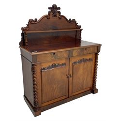 Victorian mahogany chiffonier, raised shaped back with applied carved fleur-de-lis and scrolling foliate decoration, fitted with two drawers over panelled cupboard, flanked by canted spiral turned pilasters
