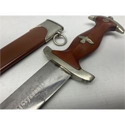 WW2 German SA dagger the 22cm double edged steel blade by G. Felix Gloriawerk Solingen inscribed 'Alles Fur Deutschland', the cross-piece impressed with the SA Gruppen mark Nm verso for Nordmark, wooden grip inset with eagle and SA emblem; in brown painted scabbard with nickel mounts L37cm overall