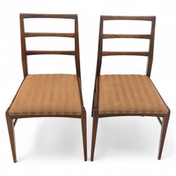 Richard Hornby for Fyne Ladye - mid-20th century afromosia teak dining table, tapered rectangular top with fluted edge and recess for spare leaf, raised on slender legs, four teak framed chairs, of ladder back design, with drop-in seat, upholstered seat, with tapered front legs and slightly raked rear legs,, table unextended width 106cm depth 79cm height 74cm with additional leaf 45cm wide- chairs width 48cm depth 41cm height 87cm 