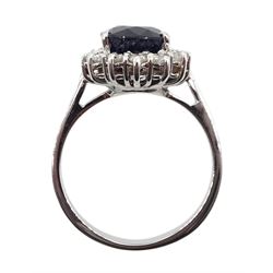 18ct white gold sapphire and diamond cluster ring, hallmarked, sapphire approx 3.55 carat, total diamond weight approx 0.25 carat