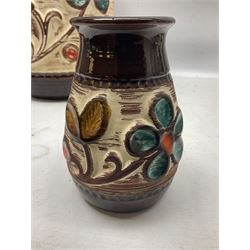 Pair of Bay West German vases, with bold moulded flower and foliage decoration in green, orange and ochre on brown ground, largest H40cm