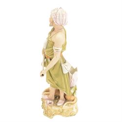 Pair of Royal Dux spill vase figures, modelled as a huntsman and water carriers, each with exotic animals to the base, H45cm