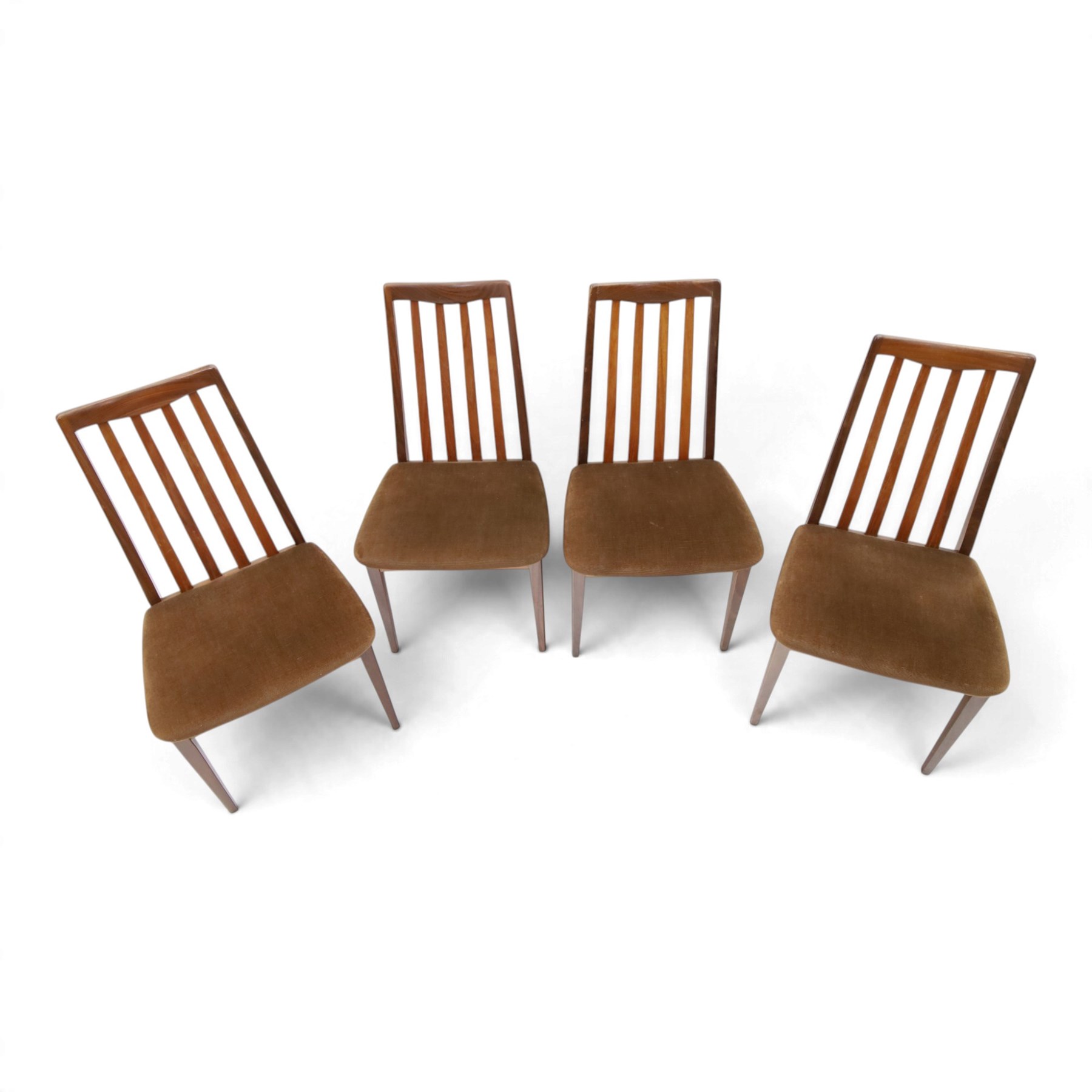 G Plan - Mid 20th century teak extending dining table and four chairs, oval top with stowed fold-over leaf extending to 208cm, raised on two shaped supports united by a stretcher 