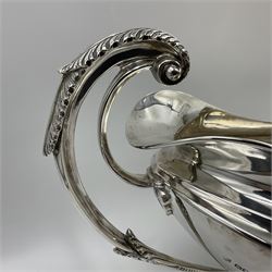1920s silver twin-handled pedestal bowl, of navette form with twin bifurcated acanthus capped scroll handles, engraved with initial R to body and upon spreading oval foot, hallmarked Hawksworth, Eyre & Co Ltd, Sheffield 1925, including handles H21.8cm