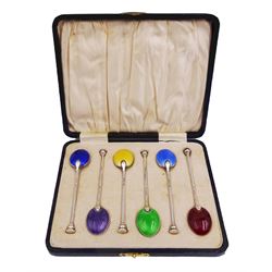 Set of six 1930's silver and enamel coffee spoons, the underside of the bowls with guilloche enamel in purple, yellow, red, green, and two tones of blue, hallmarked William Suckling Ltd, Birmingham 1932, in fitted case, approximate gross silver weight 1.82 ozt (56.8 grams)
