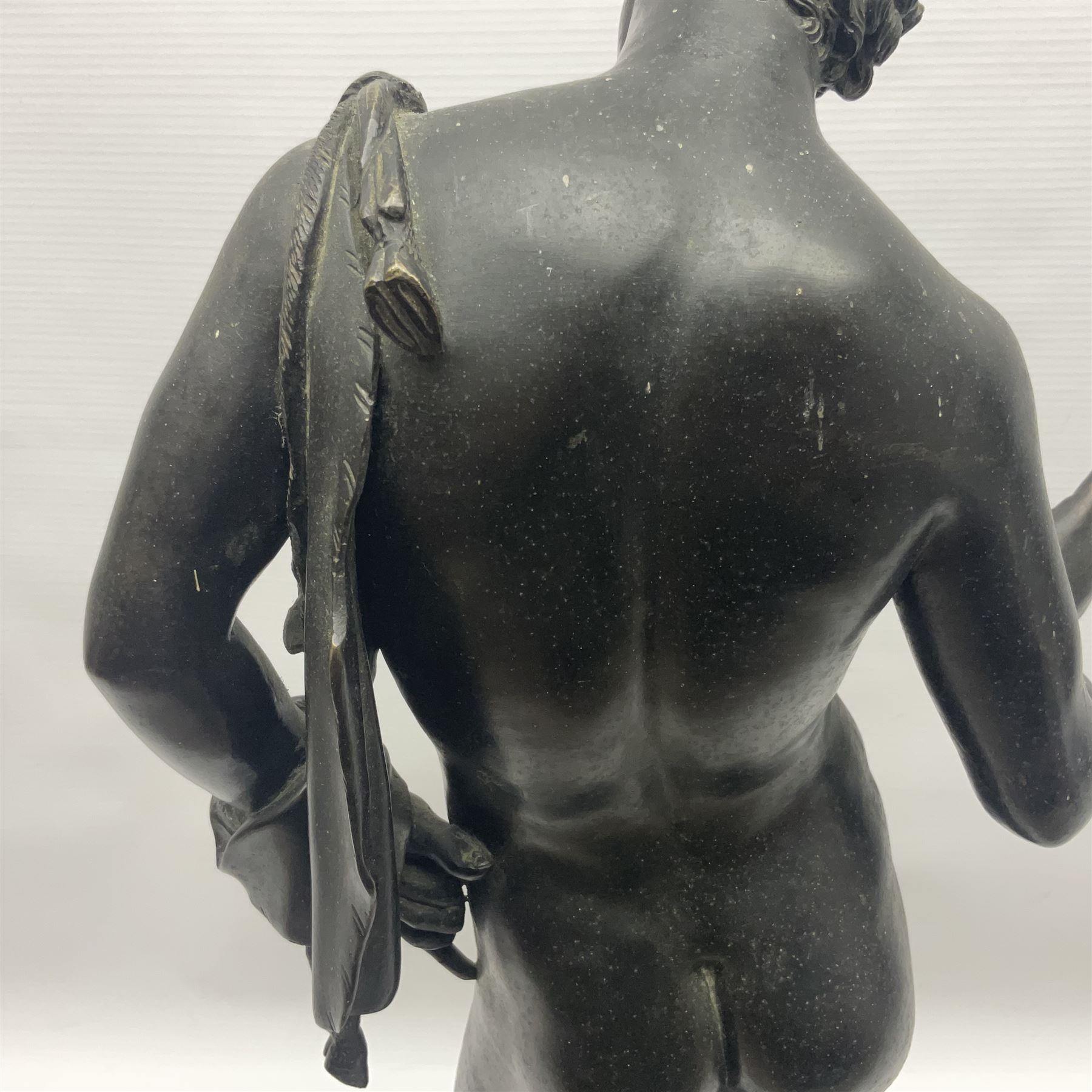 Bronzed classical nude male figure, upon a stepped circular base, H61cm 