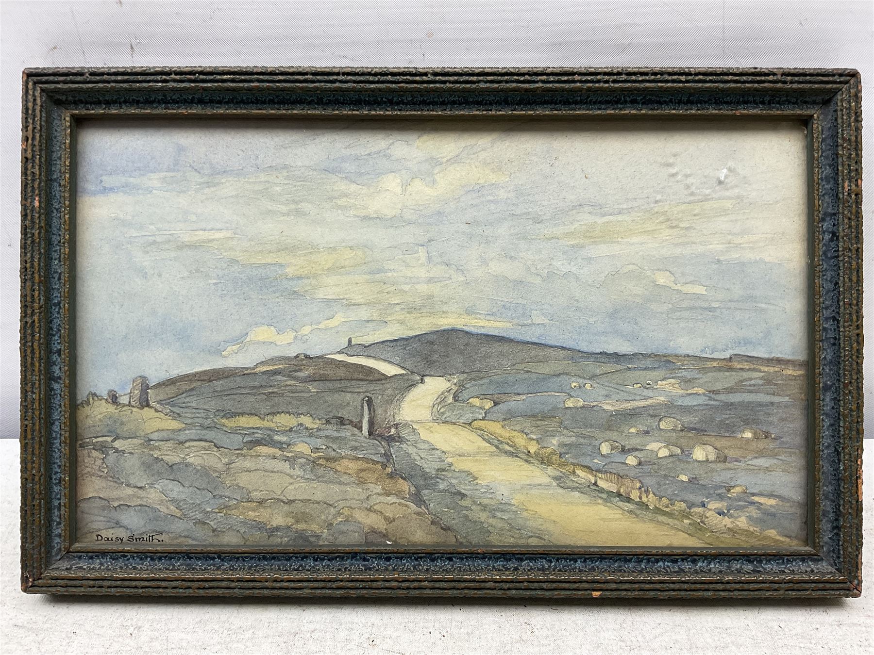 Daisy Smith (British 1891-1983): A Moorland Road, watercolour signed, indistinctly inscribed verso 14cm x 24.5cm