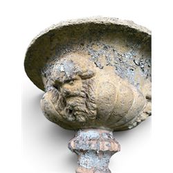 19th century terracotta campana shape urn planter, egg-and-dart moulded rim over a cherub-mask and gadrooned underbelly, turned pedestal and socle on square base
