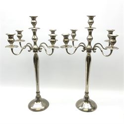 Large pair of alloy metal four branch table candelabras with scroll decoration H67cm. 