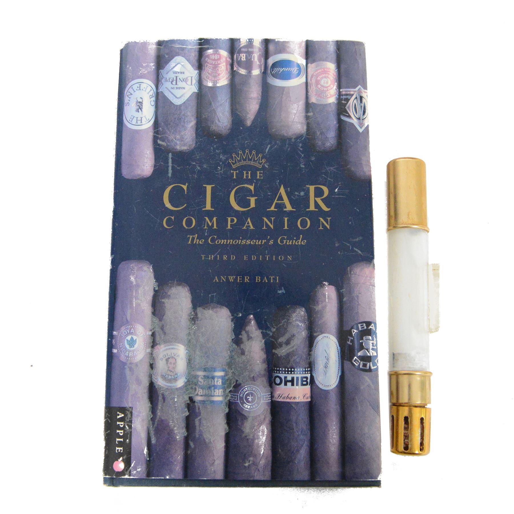 Elie Bleu of Paris, mahogany humidor with partitioned interior and inset hygrometer, together with two cigar cases and The Cigar Companion book