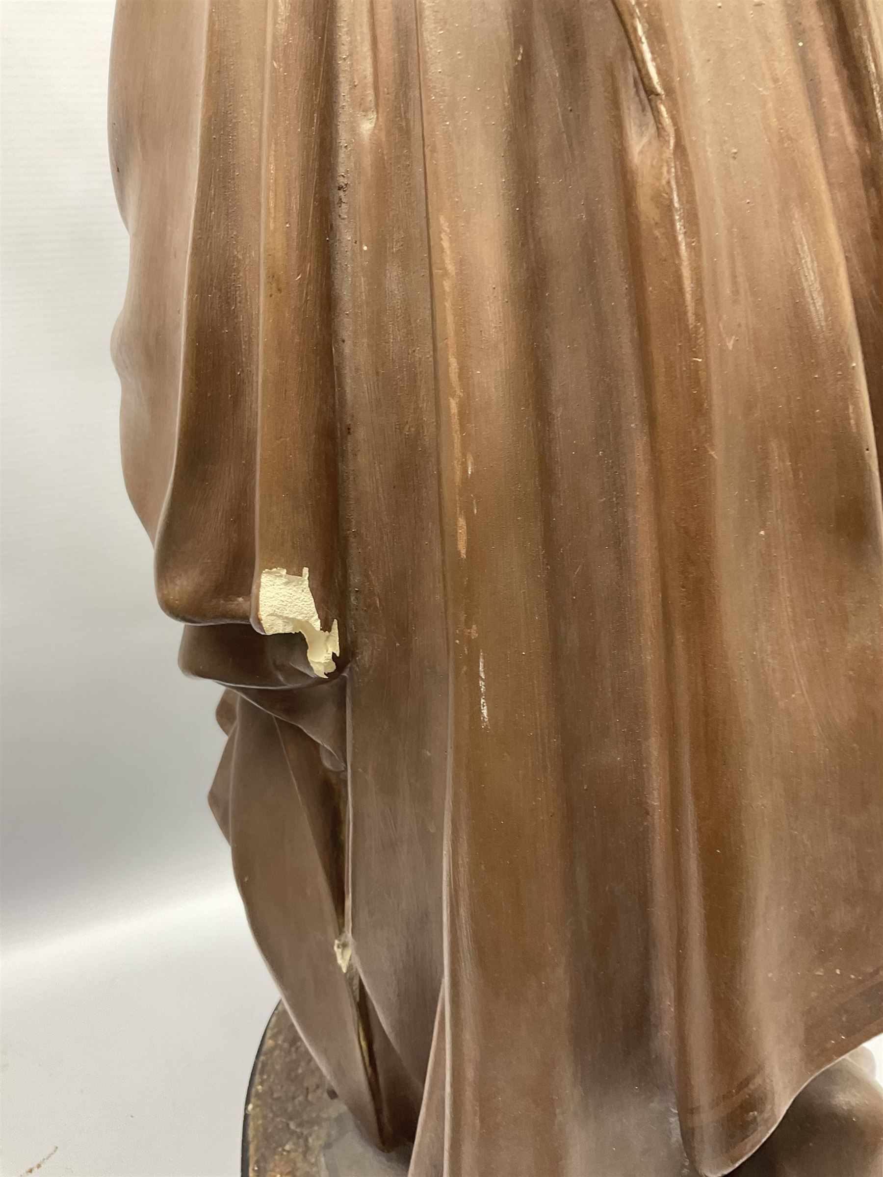 Two religious painted plaster figures of Mary and Joseph kneeling on oval plinths, with impressed mark 'Raffl et Cie Paris', H60cm 