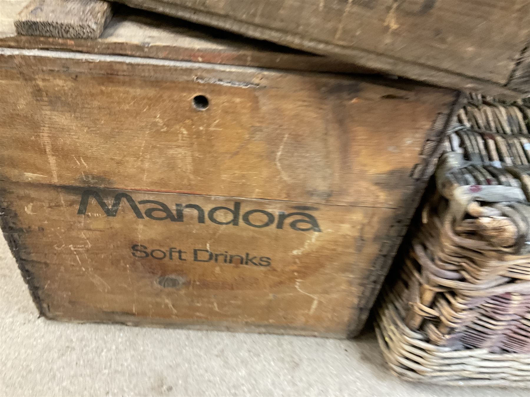 Two wicker baskets, three pine lidded bottle crates with quantity of glass bottles, comprising one with R.L. June & Co Ltd Mansfield black lettering and pair detailed Mandora Soft Drinks, Mappin & Webb blue cardboard box and framed With the Colours Punch 1924 print, larger basket W60cm