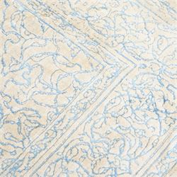 Large cream ground carpet, with overall arabesque design in light blue, within scrolling border 