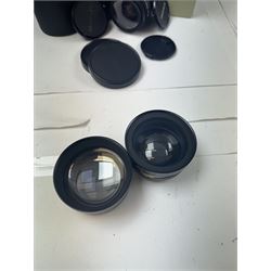 Group of camera lenses, comprising Yashica AF 70-210mm 1:4.5 58mm lens serial no. F6106983, boxed, Yashica AF 35-70mm 1:3.3-4.5 52mm Macro lens serial no. F60231147, Yashikor Aux Wide Angle 1:4 lens and a Yashikor Aux Tele-Photo 1:4 lens, Mamiya-Sekor E 1:2.8 f=28mm serial no. 13427 and a Mamiya-Sekor Zoom E 1:4 f=80-200mm lens serial no. 11271