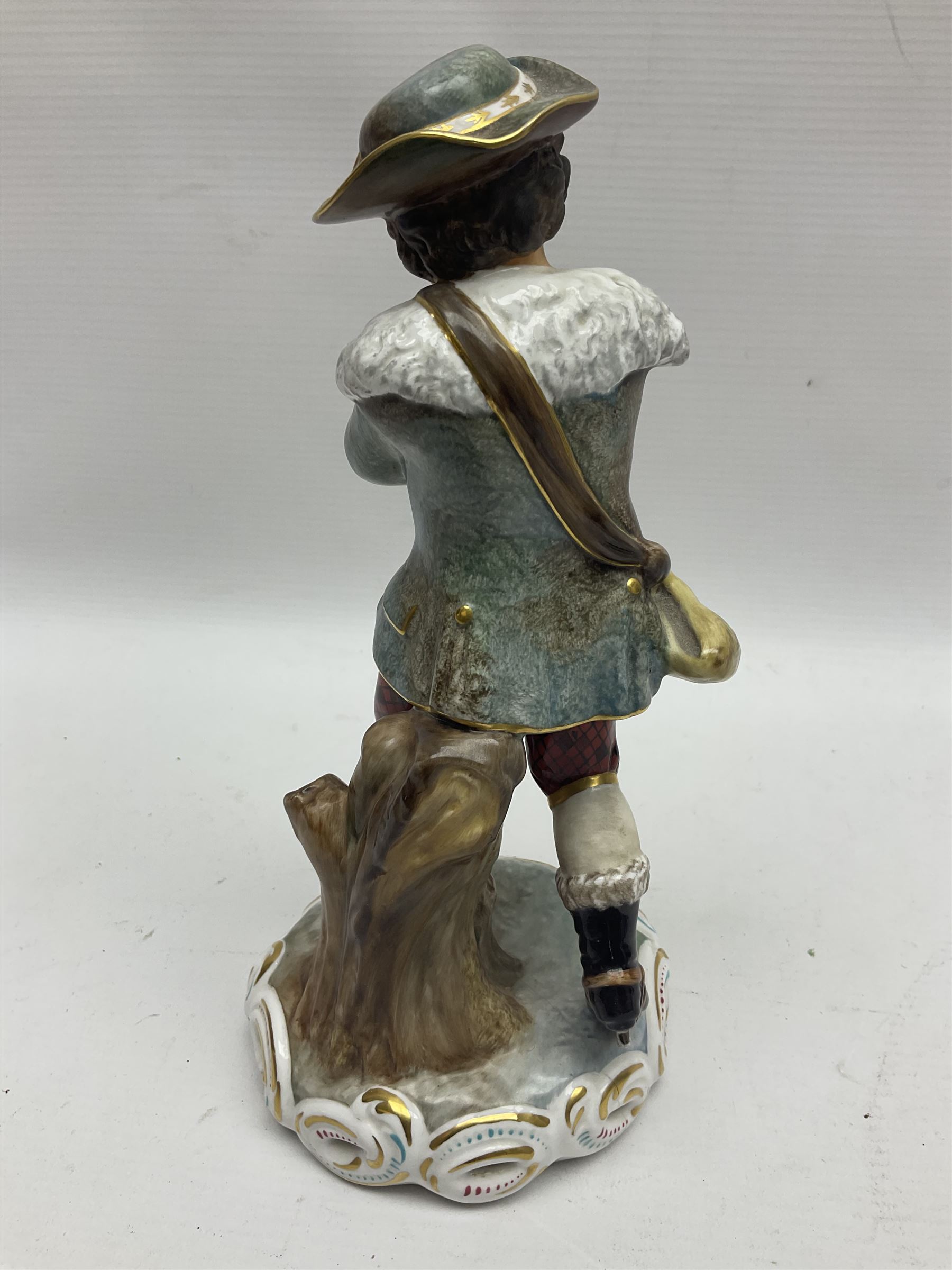 Royal Crown Derby figurine, Winter, modelled as a man with crossed arms on ice skates, by M. Townsend, with printed marks beneath, H24cm