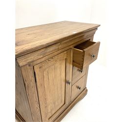 Light oak side cabinet fitted with three drawers and cupboard