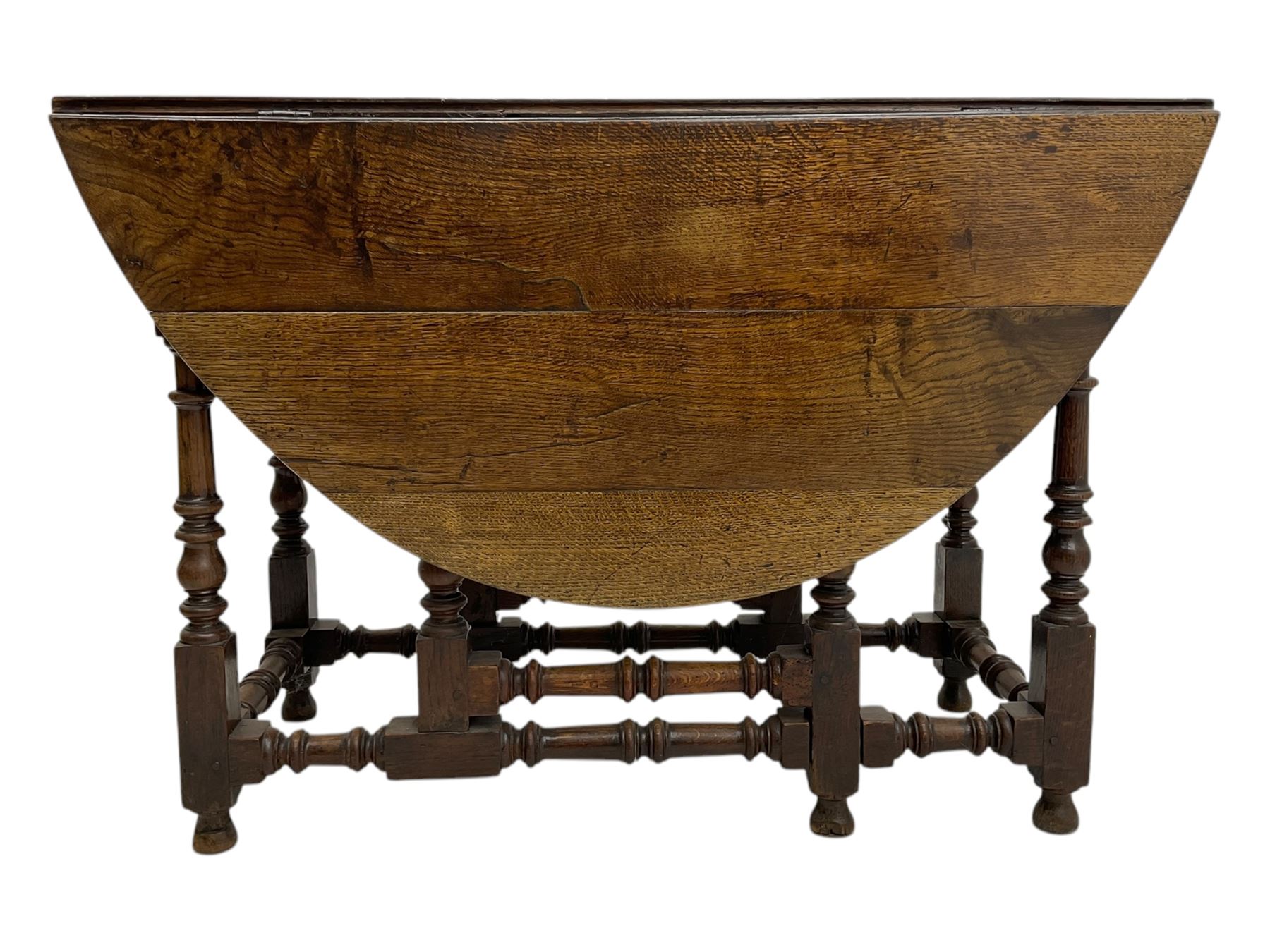 18th century oak drop leaf table, oval top with two drop leaves and frieze drawer, raised on turned supports with turned stretchers