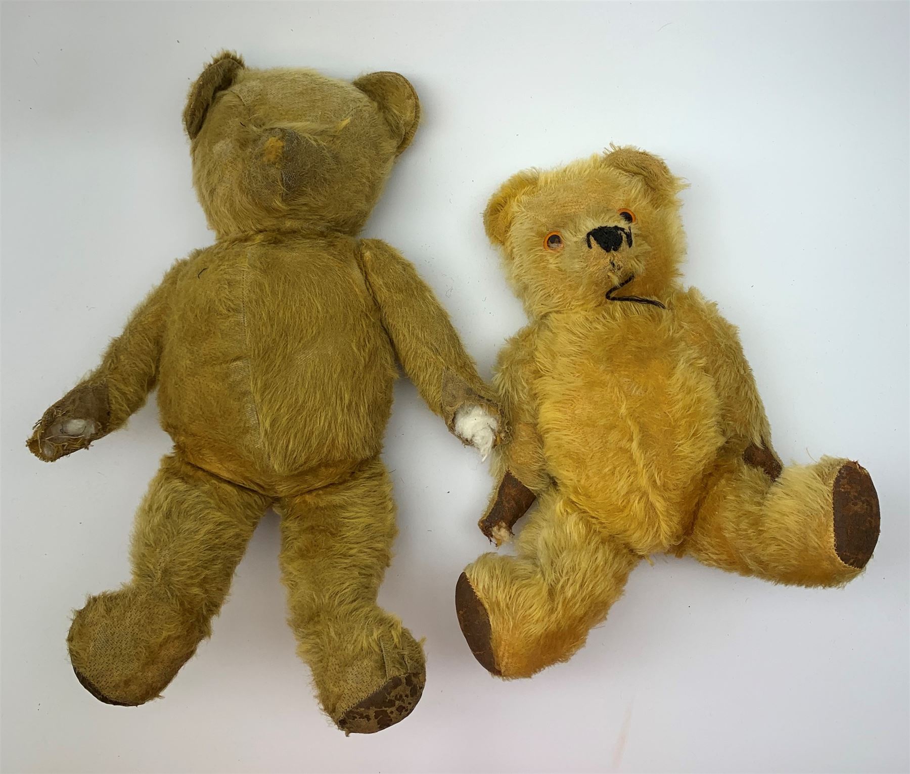 Five British teddy bears 1930s-50s including Irish Tara bear with swivel jointed head, glass eyes, vertically stitched nose and mouth, inoperative musical movement and jointed limbs H15