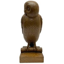 Acornman - carved oak owl perched on branch, on tooled block plinth carved with acorn signature, by the workshop of Alan Grainger, Brandsby (carved by Norman Darnley)