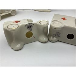 Ten WW1 crested china military models comprising seven field ambulances and three 'Home Fires Burning' fire-surrounds/range; various makers including Willow Art, Arcadian China, Grafton China, Savoy China, Carlton China etc; various crests including Devon, Aldershot, Portsmouth, West Ham, Coventry, Oxford, Hastings, Brighton etc (10)