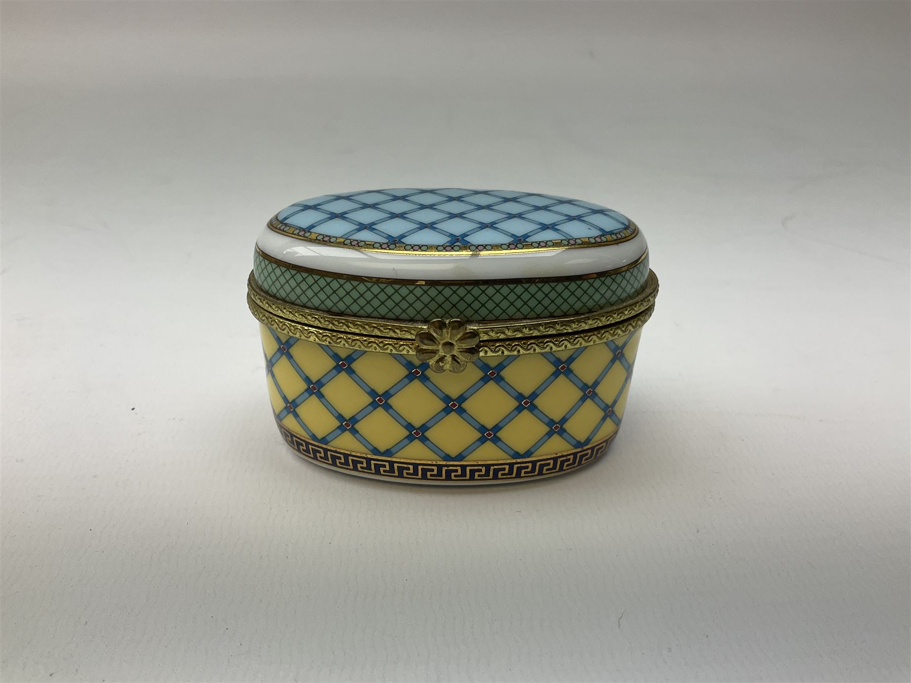 Late 19th Century pot lid bearing ‘The Residence of Anne Hathaway, Shakespeare’s Wife’ below printed decoration of thatched houses and animals scene, Royal Crown Derby Chinoiserie pattern coffee can and saucer, Rd No 758225, and an oval trinket box with gilt decoration bearing interlaced L mark to base (4)