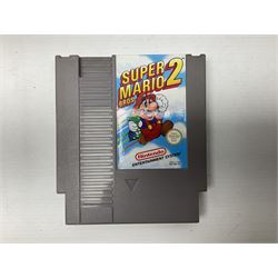 Nintendo Entertainment System (1985) console with two controllers, accessories and instruction booklet. NES Games ‘Duck Hunt’ with Nintendo Zapper gun, ‘Pinball’ and ‘Super Mario Bros.’, all with original sleeves and instruction booklets. NES game ‘Super Mario Bros. 2’ cartridge only