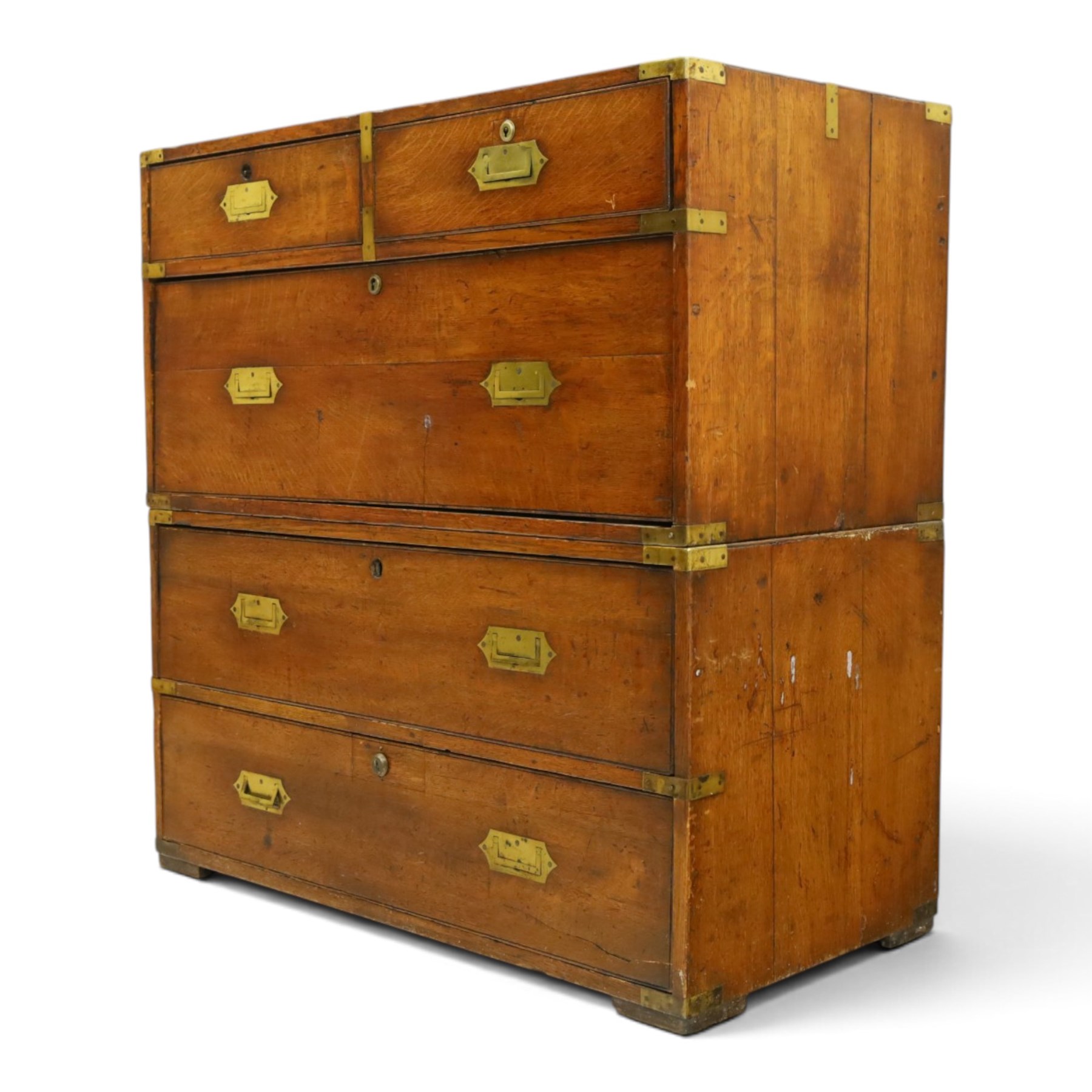 19th century brass bound mahogany campaign chest, with brass bound corners and edges, recessed brass handles, the upper section with two short over one long drawer, the lower section with two long drawers