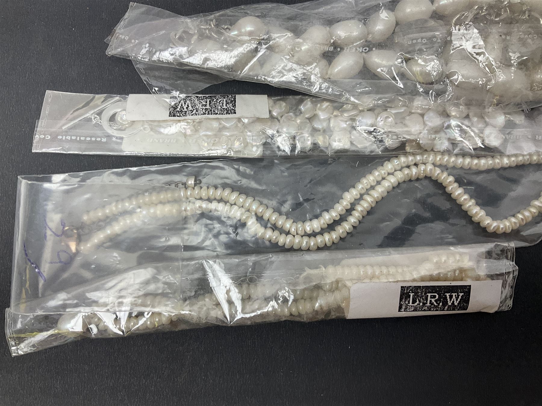 Fresh water pearl jewellery, including chain bracelet and seven necklaces, including pink example and some with silver clasps