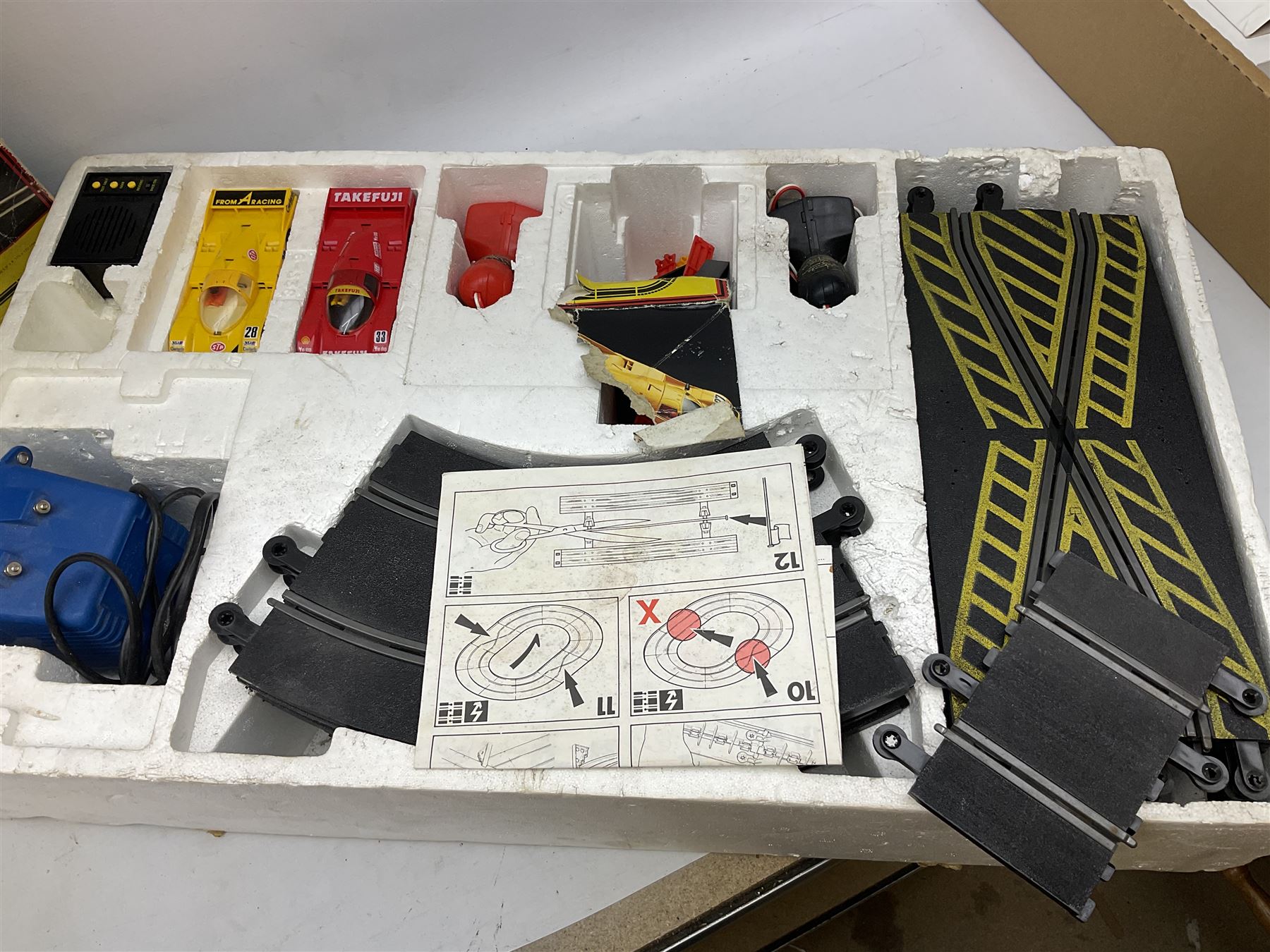 Scalextric - Porsche Power Set; boxed; Subaru Competition Rally Set (track and controllers only); boxed; Formula 1 Racing Car Set; polystyrene box base only; together with large quantity of track in four boxes; and quantity of accessories including vehicles, part vehicles for spares or repair, fencing, bridge, spare controllers etc
