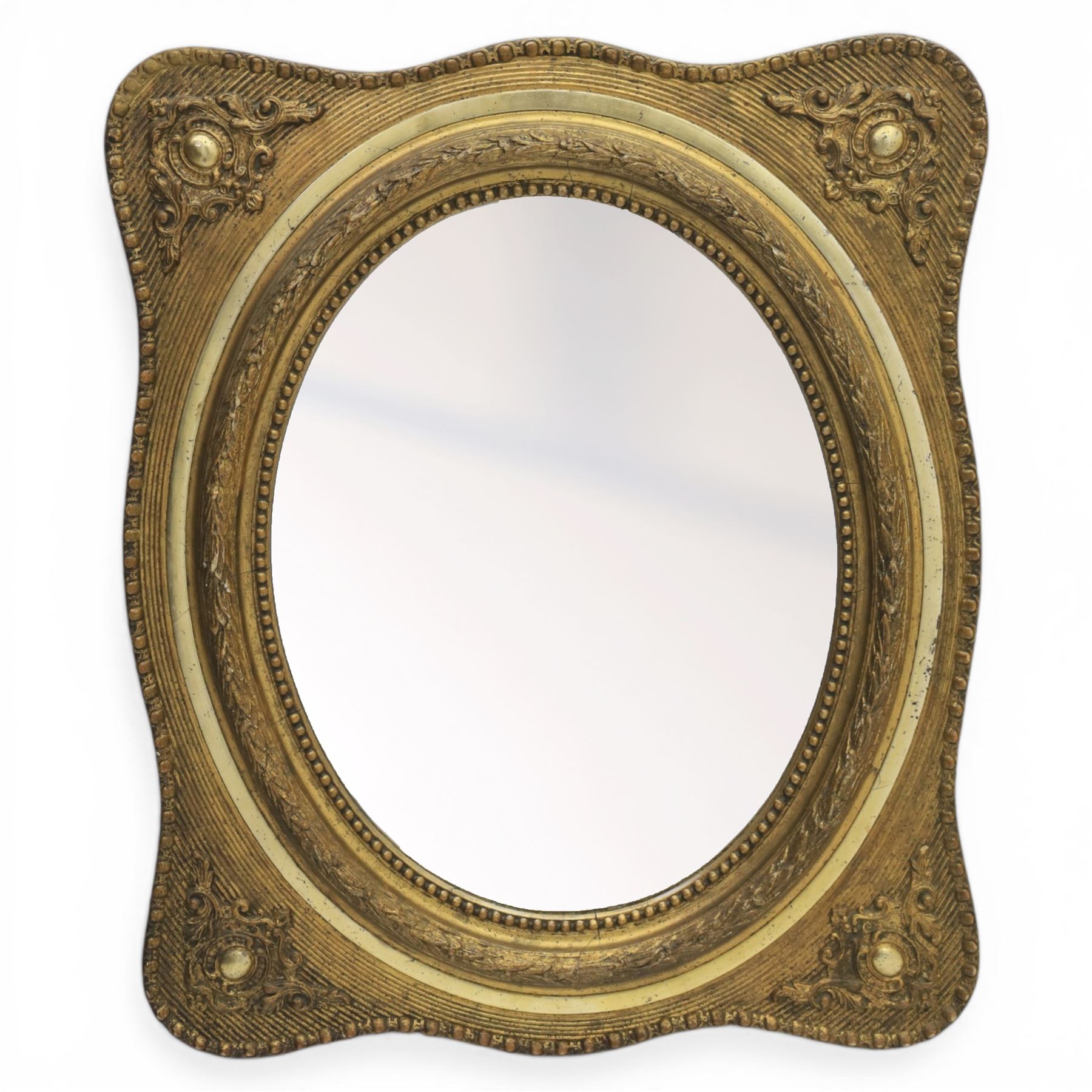 Early 20th century giltwood mirror, oval mirror plate, surrounded by egg and dart moulding, with foliate motifs