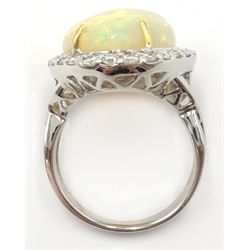  18ct white gold pear shaped opal and diamond cluster ring, stamped 750, opal approx 10.6 carat, diamonds approx 1 carat  