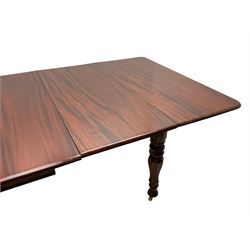 19th century mahogany extending dining table with three additional leaves, rectangular top with rounded corners, pull-out action, on turned and faceted supports with brass castors