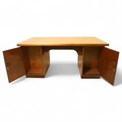 Mid 20th century teak twin pedestal partners desk, rectangular top with rounded corners with integral frieze storage shelf, above  pedestals each fitted with three drawers, recessed circular pull handles, cupboard doors fitted to the opposing side on concealed plinth bases