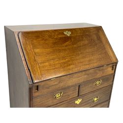 Georgian red walnut and mahogany bureau, moulded rectangular fall front with rounded upper corners, the interior fitted with sliding storage well, a combination of small drawers and pigeons holes, two short and two long drawers below, on bracket feet