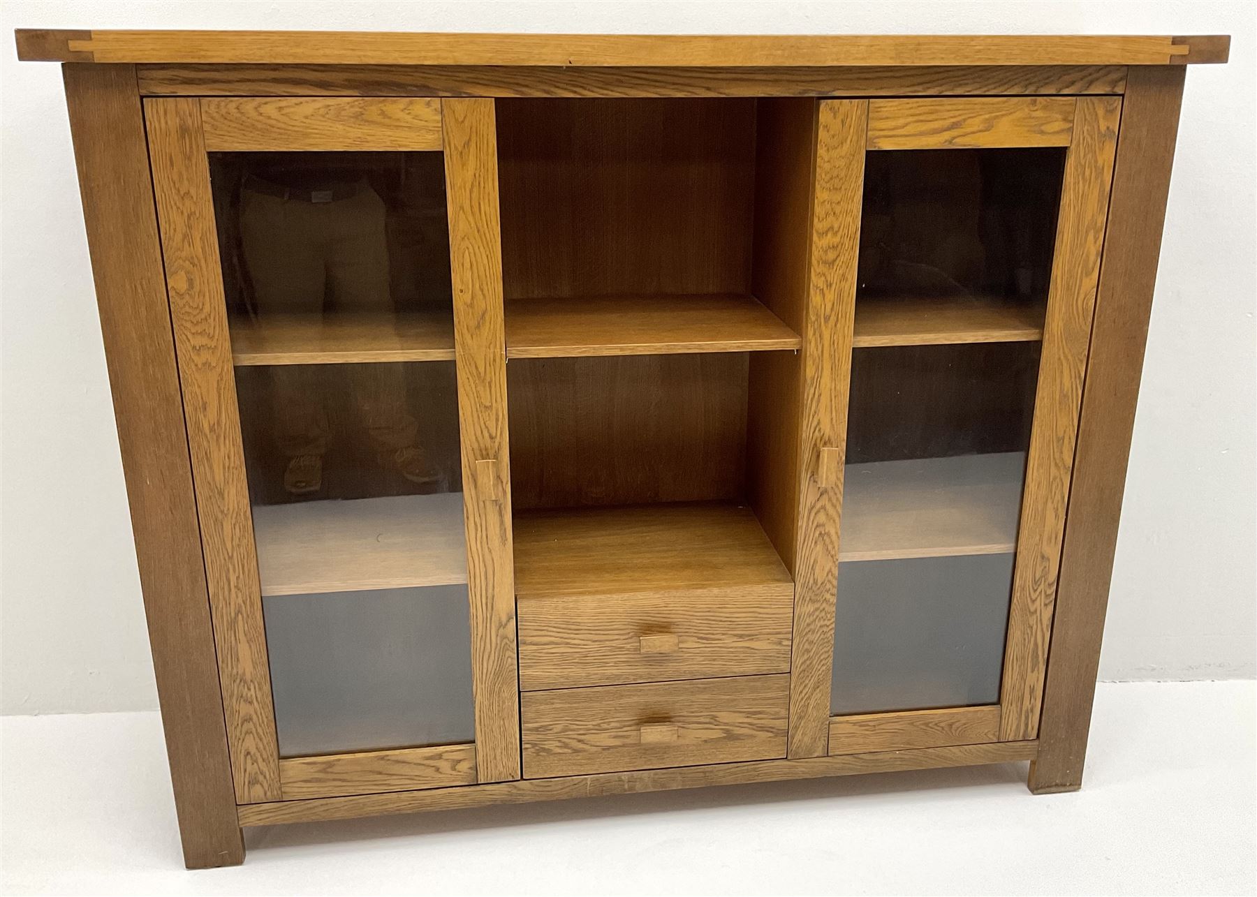 GPlan medium oak display two glazed doors flanking single shelf and two drawers, stile