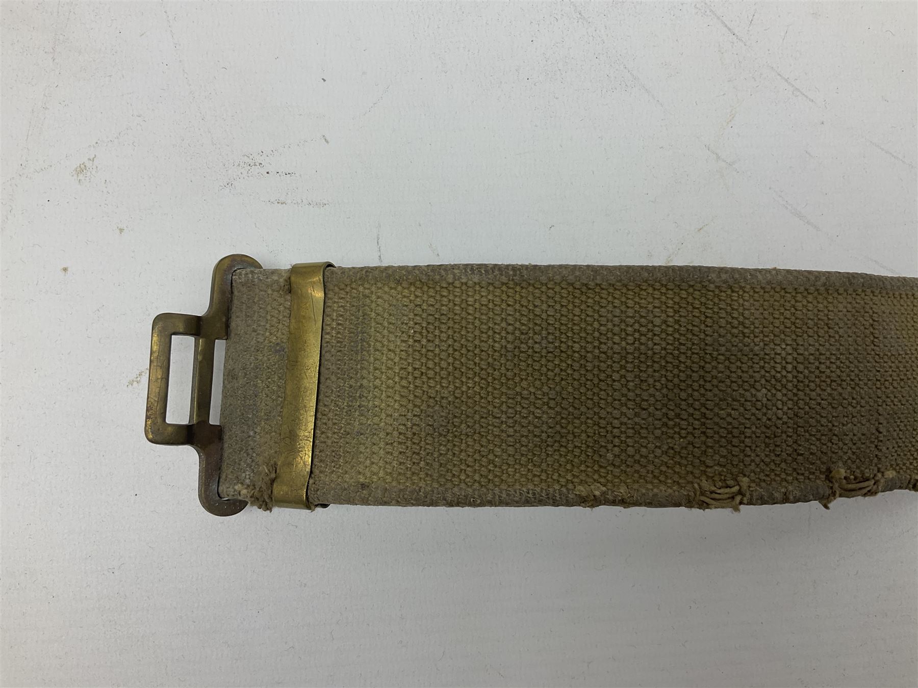 WW2 British black felt beret with Pioneer Corps cap badge, with Kangol Wear maker's mark dated 1943; and a British Army green webbing belt (2)