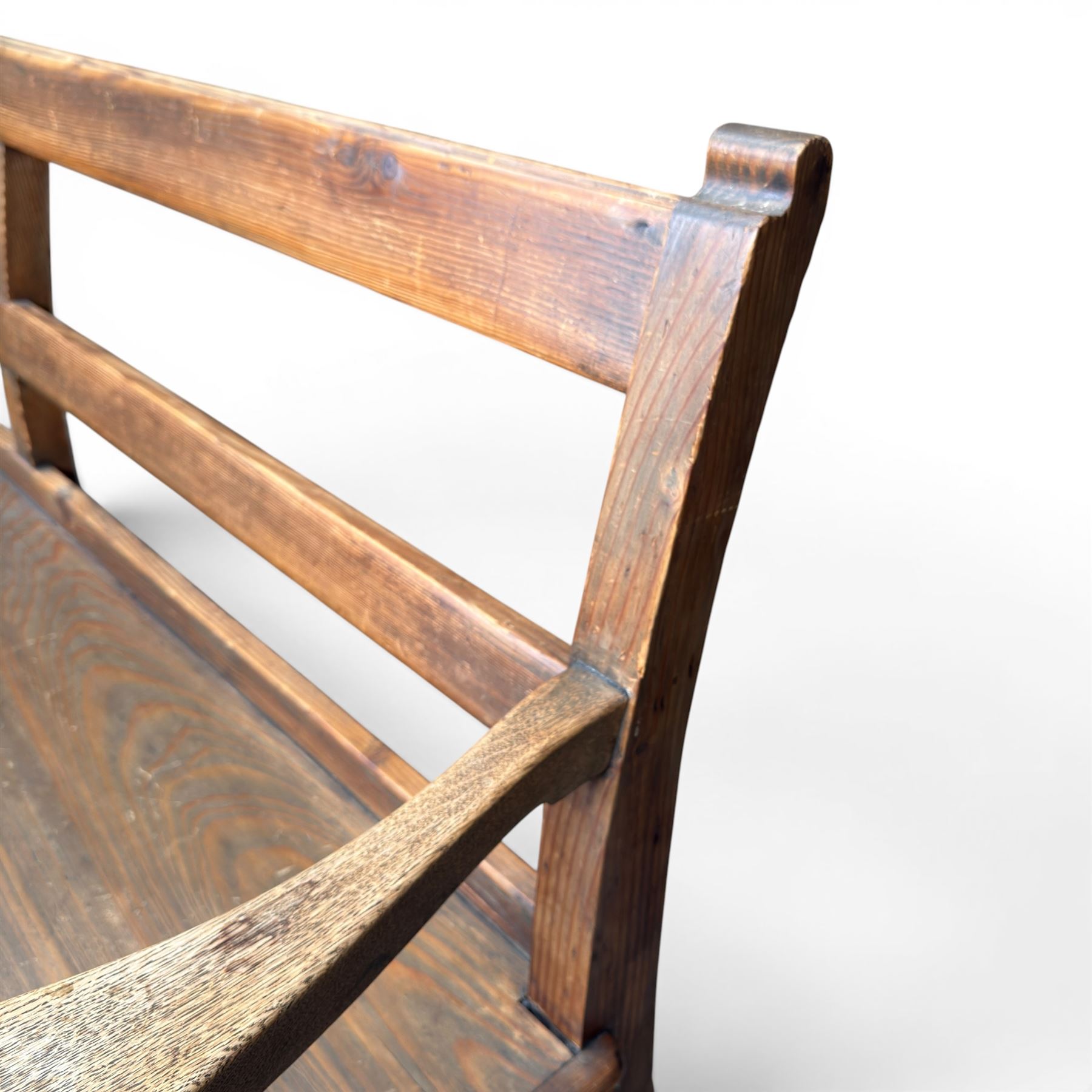 Early 20th century pine and oak bench seat, stained pine rail back frame with shaped oak arms
