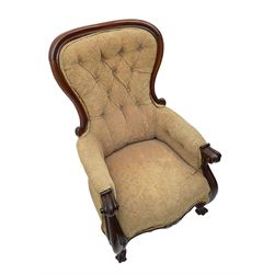 Victorian mahogany upholstered armchair, moulded framed, scroll carved arm terminals on scrolled cabriole supports, shaped carved apron