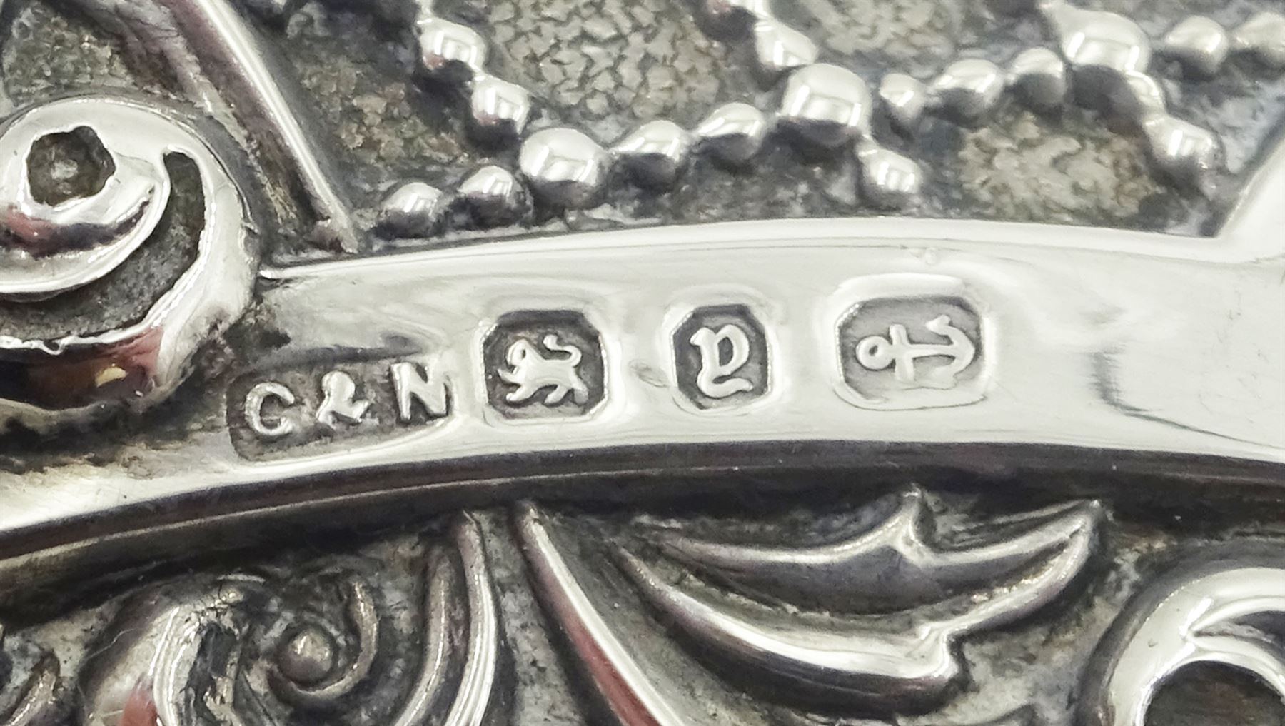 Victorian silver and ivory page turner, the repousse silver handle with foliate and C scroll decoration, hallmarked Crisford & Norris Ltd, Birmingham 1898, L35.5cm