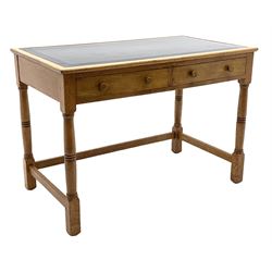 Late 20th century oak writing table desk, rectangular top with inset black leather top above two drawers, turned supports joined by stretchers