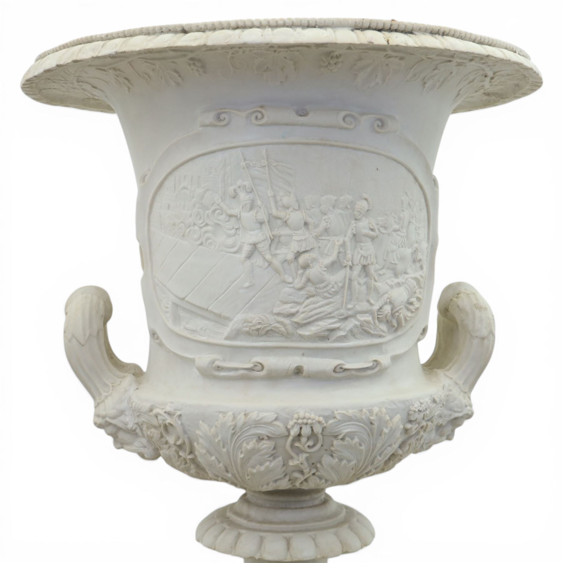 Pair of composite campana urns on stands, the urns decorated with relief figural panels and foliate bands with scrolling handles, on circular socles, the pedestals of square tapering form with moulded edges and applied classical motifs