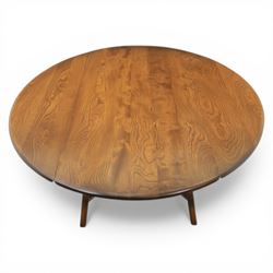 Ercol - elm oval drop leaf table, the oval moulded top with twin hinged leaves, supported on tapering legs with double stretchers (Extends to 124cm)