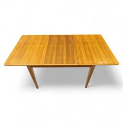 Gordon Russell - mid 20th century teak dining suite, comprising rectangular extending dining table and six matching chairs including one carver, each chair with padded upholstered seat and backrest in vinyl, on square supports, the table with plain top and rounded edges on tapered legs, an example of the firm’s functional post-war design with restrained modernist detailing (Chairs H 85cm, W 47cm, D 46cm) (Extends to 154cm)