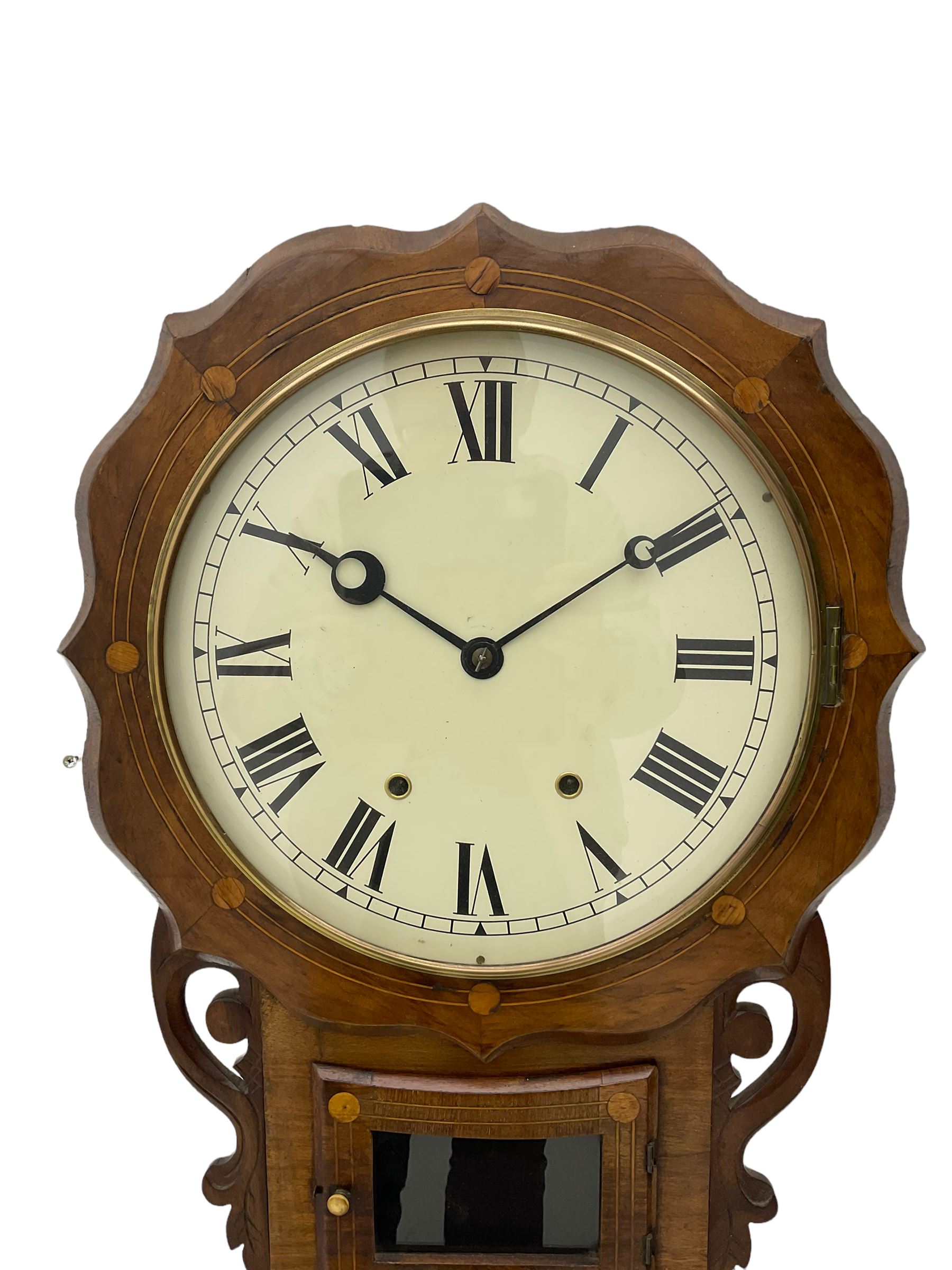 An American drop dial wall clock in a light mahogany case with inlay