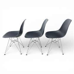 Vitra - set of six DSR side chairs designed by Charles and Ray Eames, moulded black plastic seats, raised on chromed wire Eiffel bases with plastic foot glides
