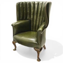 Georgian design green leather barrel-back wingback armchair, pleated upholstered back with...