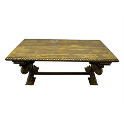 19th century Renaissance Revival carved and giltwood centre table, the rectangular top with gadrooned edge and carved frieze of repeating arched motifs with stylised scrolls, supported by a pair of carved winged griffin supports restrained by a central chained figure, on stepped rectangular bases united by carved stretcher